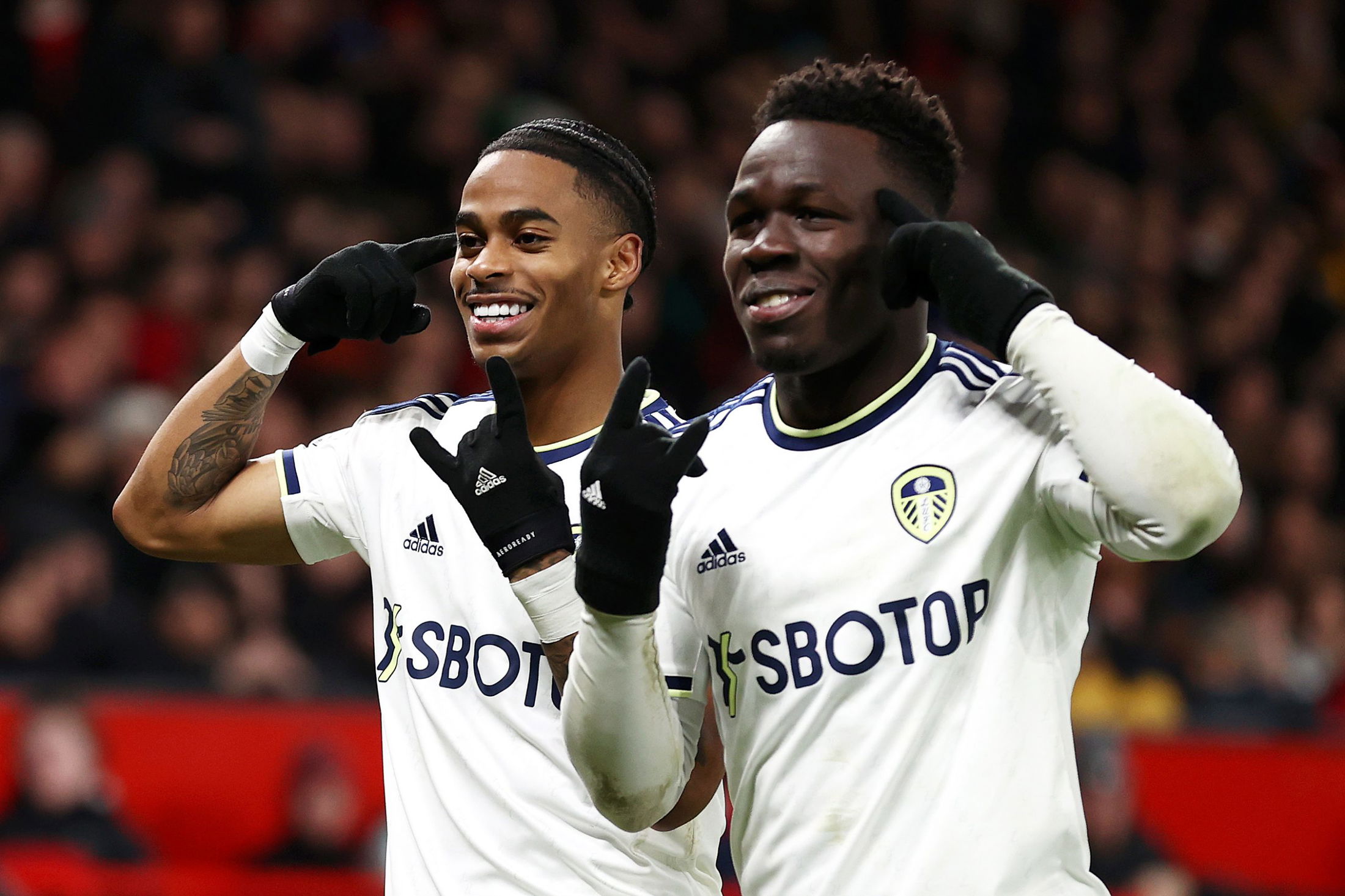  Crysencio Summerville (left) celebrates with teammate Weston McKennie (right) after scoring a goal for Leeds United against Manchester United.