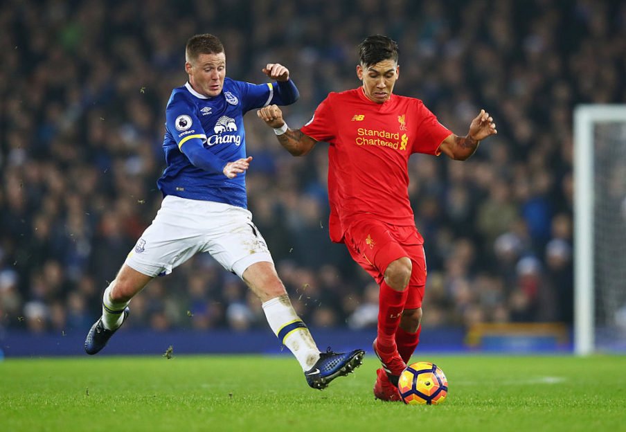 Clive Brunskill/Getty Images Sport - McCarthy tackles Firmino in the Merseyside derby earlier this season