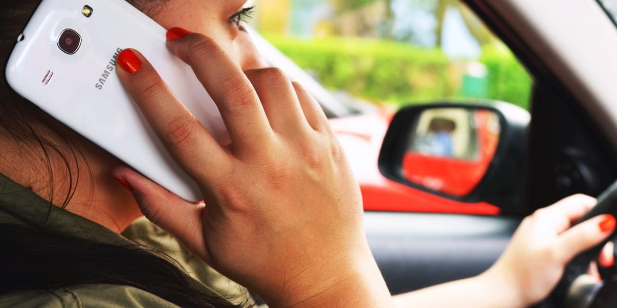Driver using a phone - Pexels