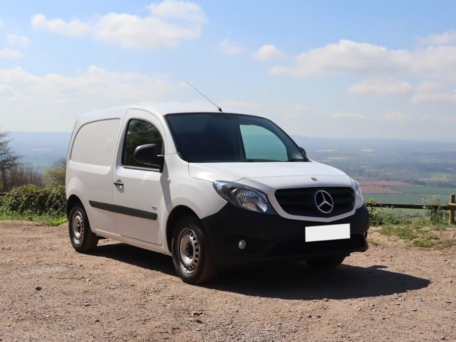 A Mercedes-Benz Citan van parked in front of a stunning view overlooking the countryside.